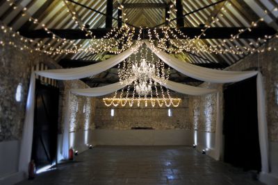 White Chandeliers with Drapes