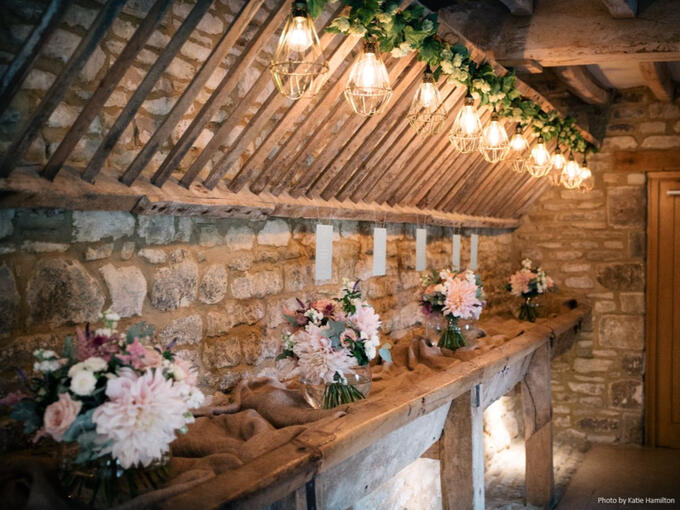Edison bulbs and greenery at Caswell House